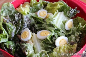 Salad with Smoked Salmon & Quail Eggs - Pour the mayonnaise over and toss gently to mix.