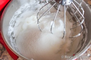 Easter Cake  - Beat egg whites and water with an electric mixer until stiff peaks form. Add sugar. 