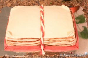 First Communion Book Cake - Make a braided cord of fondant that looks like a bookmark.