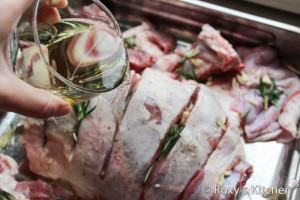 Roasted Lamb with Garlic & Rosemary - add the wine and the bay leaves