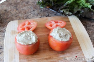 Funny Tomato Frog Stuffed with Eggplant Salad - Spoon eggplant salad into tomatoes and place the sliced top back on the tomato.