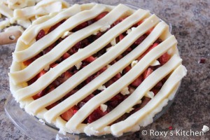 Rhubarb & Strawberry Pie - Make the lattice top by placing strips on the pie in one direction and then laying a second set over but perpendicular to the first set .