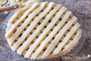 Rhubarb & Strawberry Pie - Make the lattice top by placing strips on the pie in one direction and then laying a second set over but perpendicular to the first set .