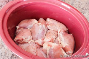 Salsa Chicken - Place the chicken thighs in the slow cooker and season with salt and pepper.
