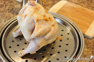 Beer Roasted Chicken  - Place the chicken cavity over the beer can. 