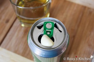 Beer Roasted Chicken - Make 2 more holes in the top of the can using a knife or can opener.