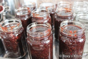 It’s better to pour half a ladle of jam in each jar to allow the jar to reach almost the same temperature as the jam. Then fill all the jars leaving 1-1.5 cm headspace. 