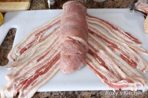 Turkey Breast Wrapped in Bacon - Roll up the breast lengthwise to create a cylinder. Arrange the bacon slices on a work surface in 6 tightly spaced parallel stripes, overlapping the ends of 2 slices to make each stripe.