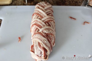 Turkey Breast Wrapped in Bacon - Place the rolled turkey breast in the center of the bacon and then crisscross the bacon around the turkey.