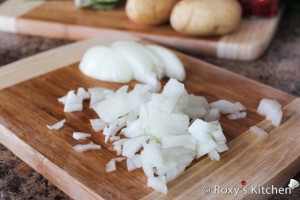 Country-Style Soup (Ciorba Taraneasca) - Chop the onion and place in a pot with water over medium-high heat.