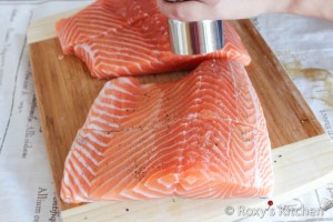Cedar Plank-Grilled Salmon - Sprinkle salt and freshly ground black pepper onto the fish fillets.