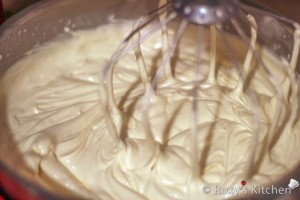 Add mascarpone to chilled mixture and using an electric mixer beat on low speed until blended and smooth. Increase speed to medium-high; beat until mixture is thick and medium-firm peaks form when beaters are lifted, about 2 minutes (do not overbeat or mixture will curdle).