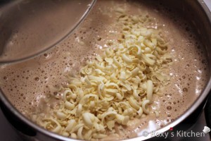 Pregnant Belly Cake - Add grated white chocolate and stir until smooth. 