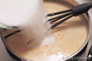 Add grated white chocolate and stir until smooth. Add remaining whipping cream and sugar and stir until sugar dissolves. 