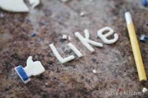 I cut out the hand and the letters for the Like button out of white fondant. 