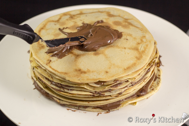 Nutella Crepe Cake – A Unique and Simple Easter Dessert - Spread about one tablespoon of Nutella between each crepe. 
