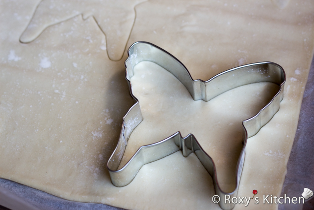 5-Ingredient Cream Cheese Berry Butterfly Tarts - Place your puff pastry sheet on parchment paper in a pan and cut out 2 butterflies per sheet using the cookie cutter.