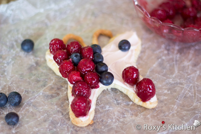 5-Ingredient Cream Cheese Berry Butterfly Tarts - Spread the cream cheese on the pastry to the rim and arrange the raspberries and blueberries on top as seen below.