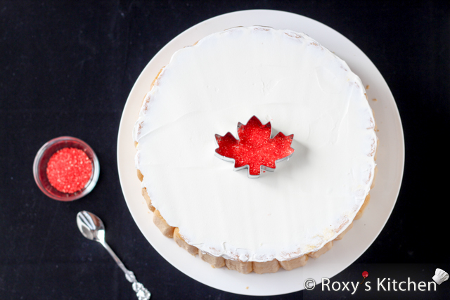 1st of July Dessert - Canadian Flag No Bake Fruit Cake - Place the maple leaf cookie cutter in the middle of the cake and, using a small teaspoon, carefully sprinkle some red sugar sprinkles to cover the inside area. 
