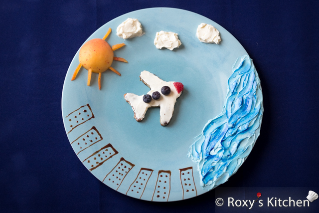 Wordless Wednesdays - Flying across the Atlantic ocean. Canada, here we come! | Roxy's Kitchen #airplane #foodart #creativefood #clouds #ocean #sun #buildings #apricot #creamcheese #chocolate #berries #toast