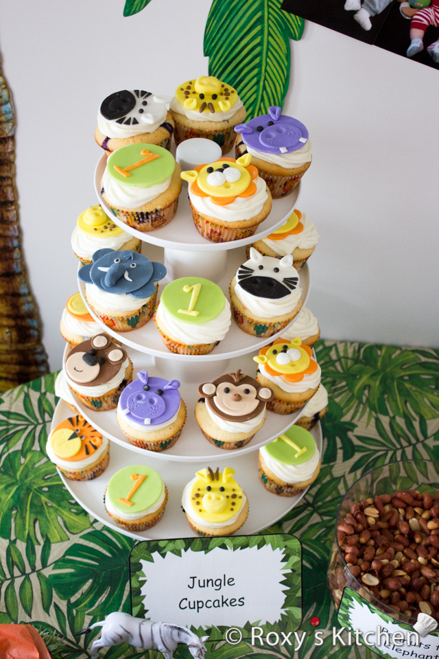 Safari / Jungle Themed First Birthday Party - Dessert Ideas: Jungle Animals Cupcakes / Jungle Animals Fondant Cupcake Toppers from lions, teddy bears, monkeys to hippos, giraffes, tigers and elephants.