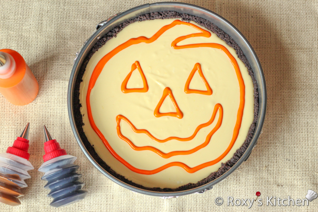 Decorated Pumpkin Cheesecake - Pipe the outline of the pumpkin using the orange batter.