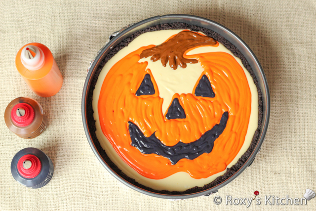 Decorated Pumpkin Cheesecake - Pipe the remaining orange batter moving your hand in an up and down motion.   