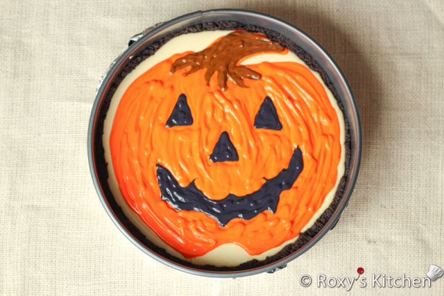 Decorated Pumpkin Cheesecake - Pipe the remaining orange batter moving your hand in an up and down motion.   