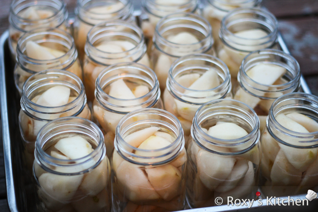 Place the pears into the hot sterilized canning jars. 