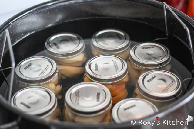 Cover jars with lids and process them in a water bath. 