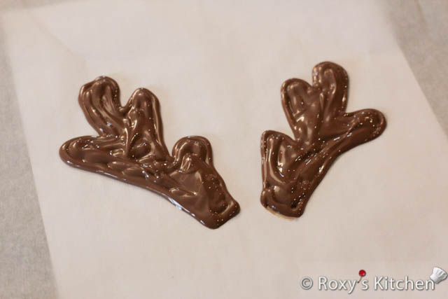 Pipe the chocolate on the parchment paper to make the reindeer antlers. 
