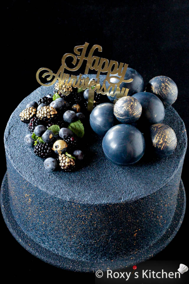 Cake decorated with chocolate balls / spheres, blueberries and blackberries