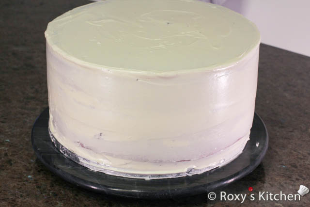 Smooth it out using a spatula. Refrigerate the cake for at least 1 hour before applying the next coat of frosting. 