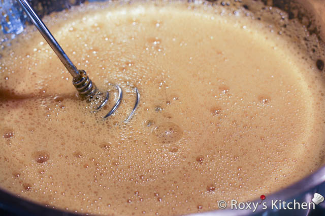 Place the eggs and sugar in a bowl over a pot of boiling water and beat until it becomes thick and creamy. 