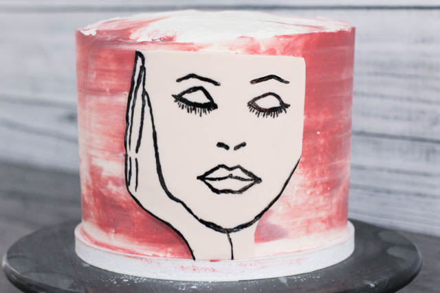Attach image decoration to the cake. 