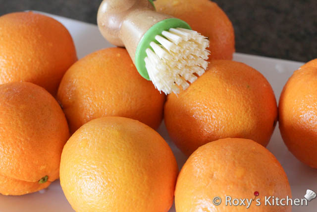 Thoroughly wash the oranges, scrubbing them a bit with a clean sponge or a vegetable brush. 