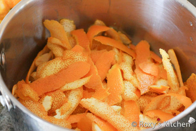 Place the orange peels in a pot. 