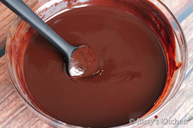 In a heatproof bowl, melt the chocolate and butter over a double boiler or in the microwave, stirring occasionally until smooth. Let it cool slightly.