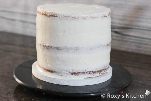 Apply a thin layer of frosting to crumb coat the cake. Smooth it out using a spatula. Refrigerate the cake for at least 1 hour before applying the next coat of frosting. 