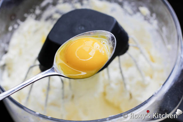 Add one egg yolk at a time, beating after each addition.