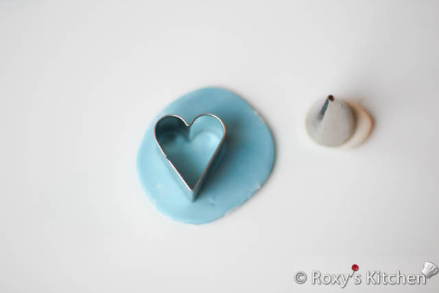 For the pacifier, I made a fondant heart using the heart-shaped cutter and just cut the pointy end of the heart. 