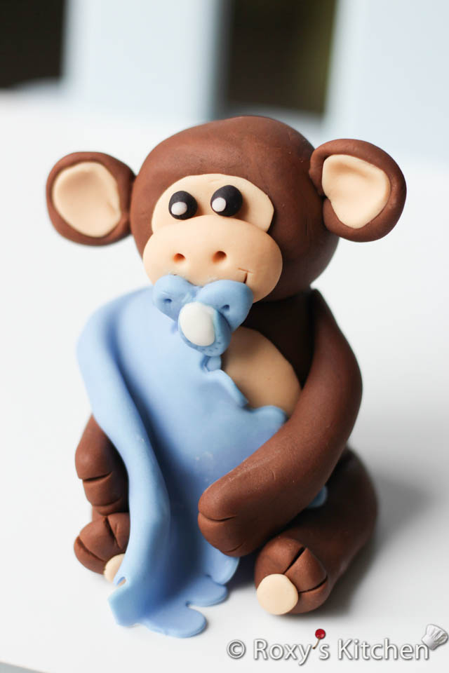 Monkey & Bananas Cake Topper - Fondant monkey with a pacifier holding a blanket