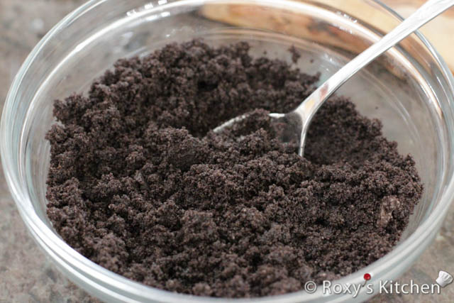 Place the Oreo cookies in a food processor and pulse until crushed into crumbs. Set aside 3 tablespoons of crushed Oreos. Pour the melted butter over the crushed Oreos in the food processor and pulse 2-3 more times until the butter is mixed in. 