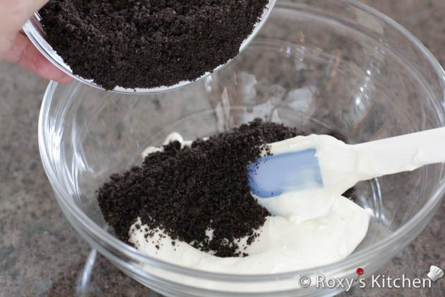 Add 2.5 tablespoons of the crushed Oreos you saved earlier to one of the bowls. 