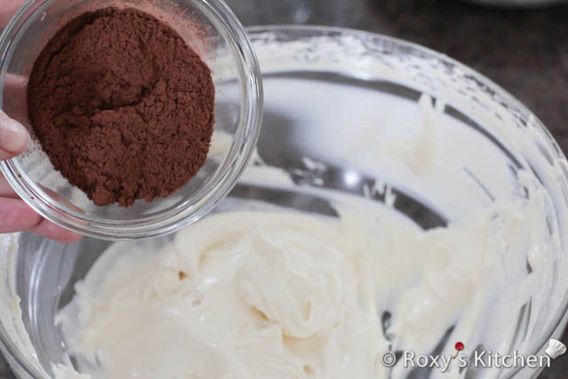 Add the sifted cocoa powder over the mascarpone frosting in the second bowl. 