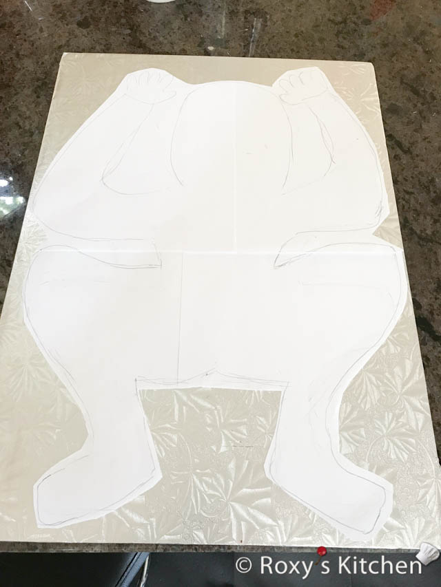 I made a paper template so that I can use it as a guide to carve the cake. 
