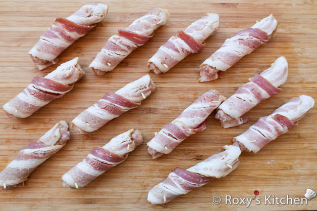 Repeat this process for each sausage, ensuring the bacon is firmly secured around the sausage.