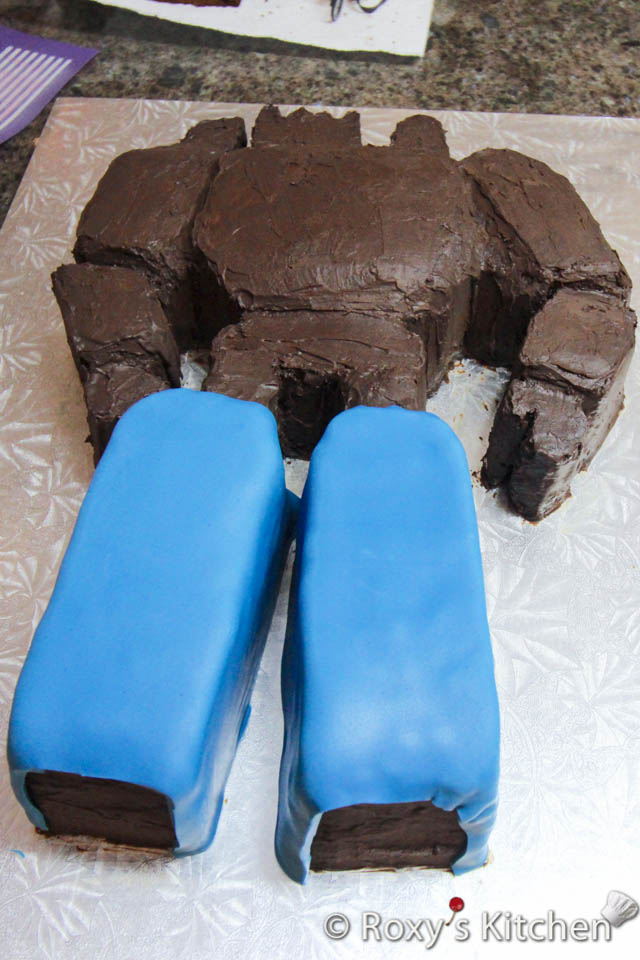 Cover the cake in fondant, one colour/section at a time, as seen in the pictures. 