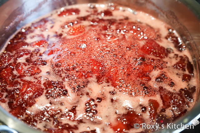 Then, bring to a boil and then simmer on medium-low heat until the strawberry syrup reaches 240°F (115°C). 
