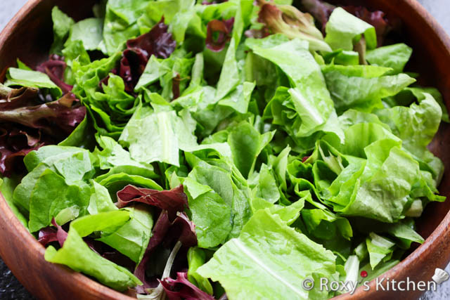 Tear or cut the leaves into bite-sized pieces and place them in a large salad bowl.